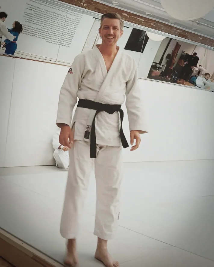 Eric possesses a third-degree black belt and specializes in ground techniques and kata, effectively demonstrating his expertise and commitment to the field of martial arts