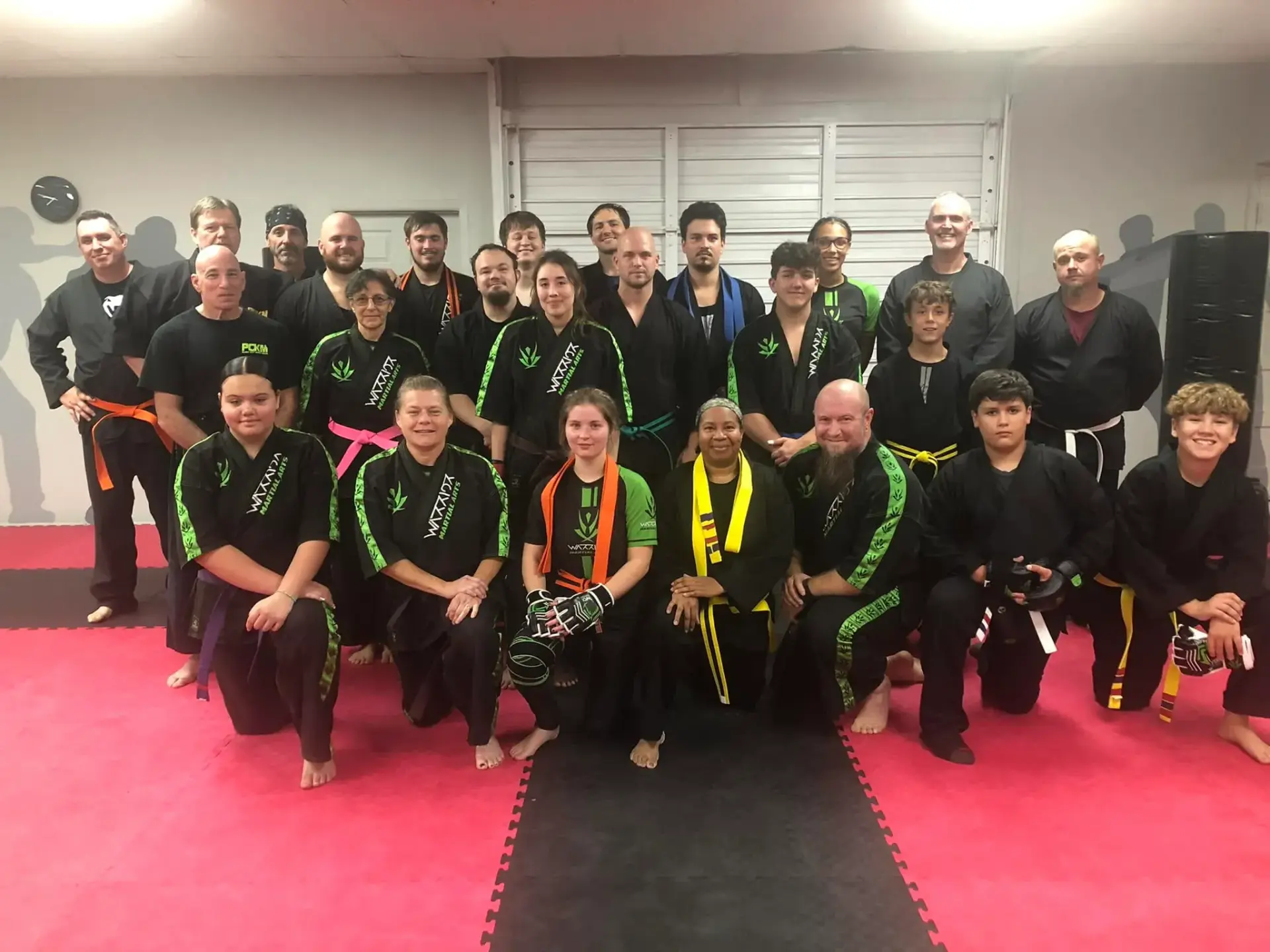 Plant City Krav Maga students posing together in the training space