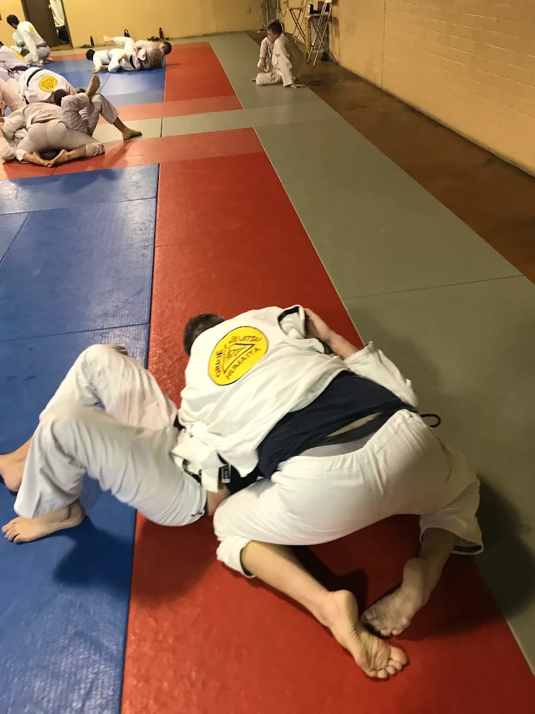 Instructor posing with a student at the academy