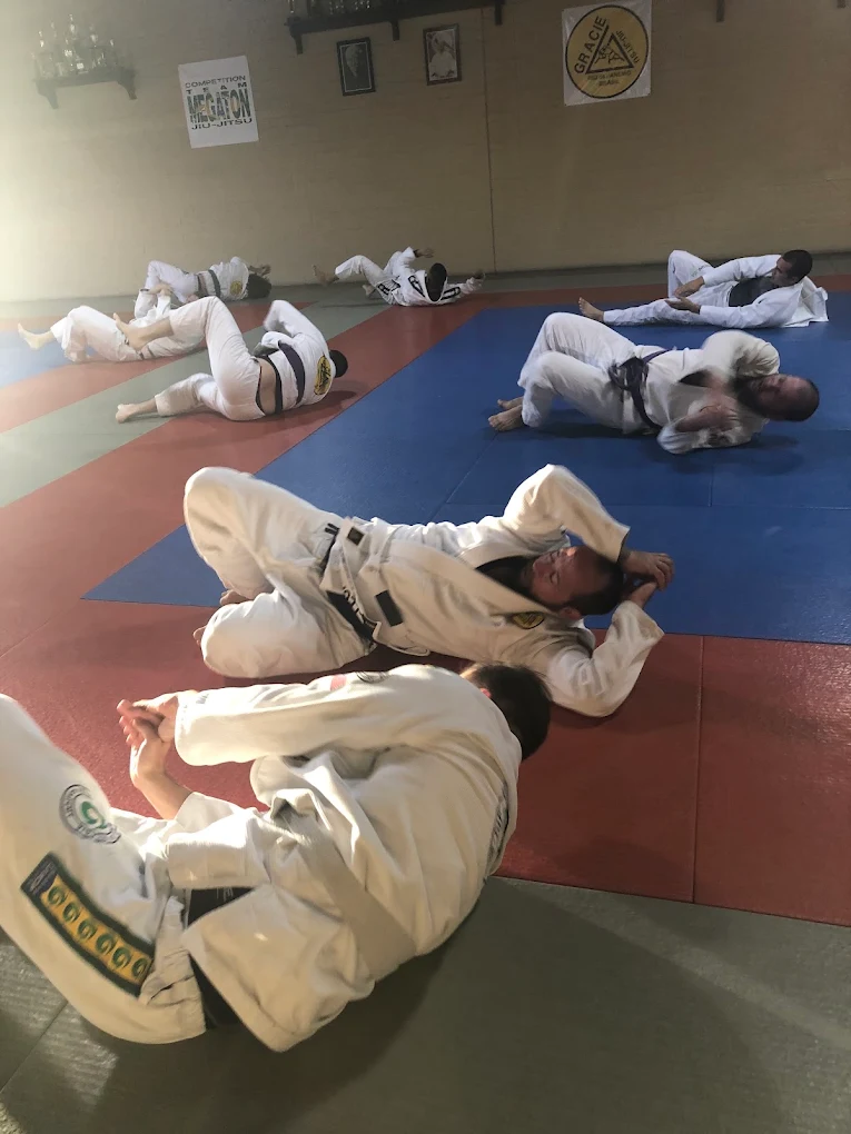 Students warming up on the mats at Gracie Jiu-Jitsu Anthem