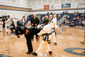 Martial arts student sparring during a tournament match