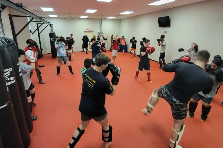 Students practicing striking drills in class