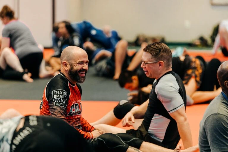 Brazilian Jiu Jitsu students smiling during training