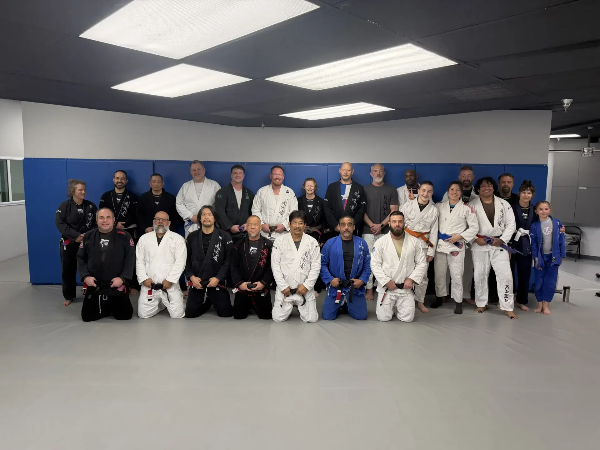 Kama Jiu-Jitsu students posing together on the mats