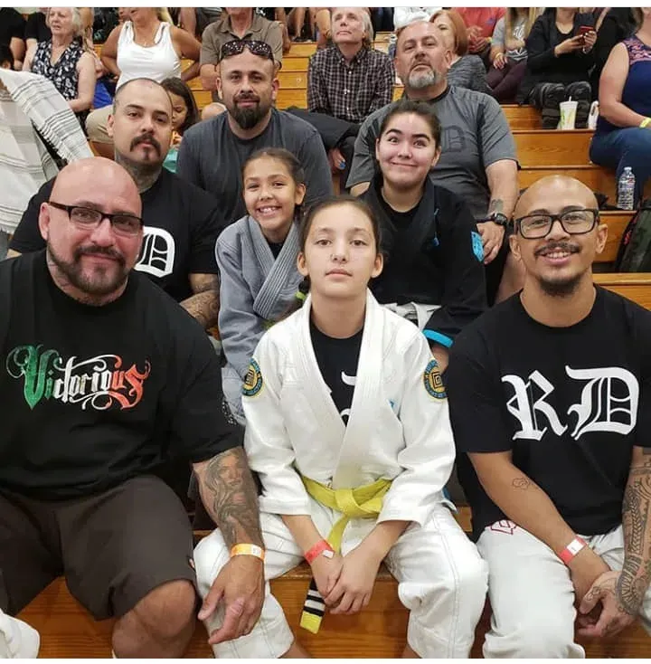 Family and students at a jiu-jitsu event